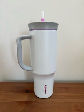 White Insulated Travel Tumbler with Gray Handle and Pink Accent